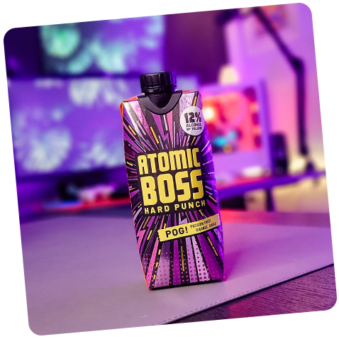 Tilted image of Atomic Boss POG! in a brightly colored studio setting